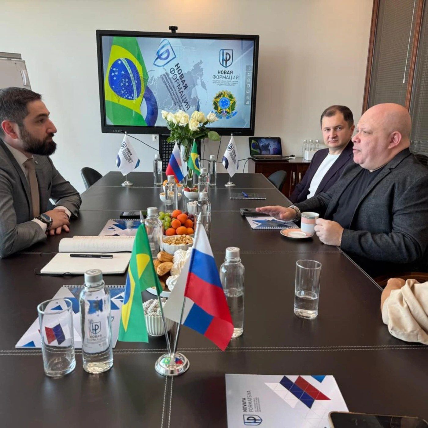 Working meeting with Brazilian and Russian flags